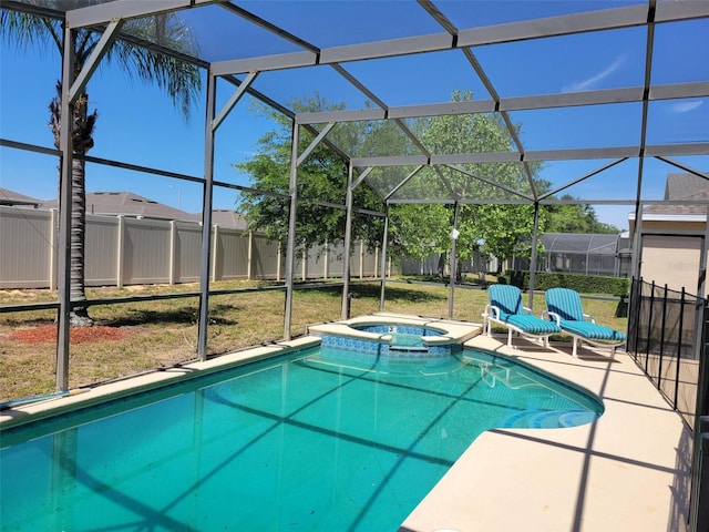 view of swimming pool featuring a patio, glass enclosure, and an in ground hot tub