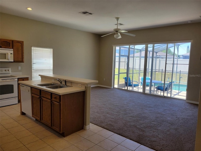 kitchen with white appliances, ceiling fan, light tile floors, and sink