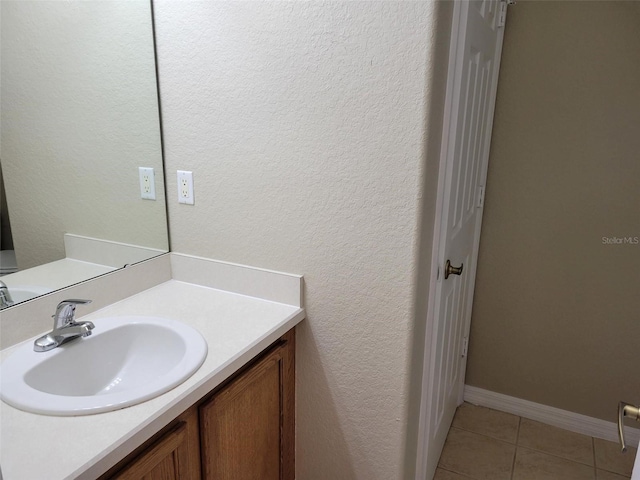 bathroom featuring oversized vanity and tile floors