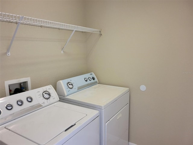 clothes washing area with washing machine and dryer and hookup for a washing machine