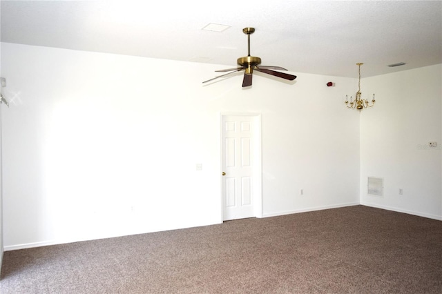 carpeted spare room with ceiling fan with notable chandelier and vaulted ceiling