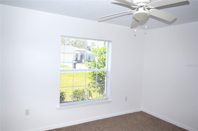 unfurnished room featuring carpet flooring and ceiling fan