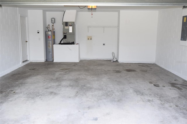 garage featuring heating utilities and water heater