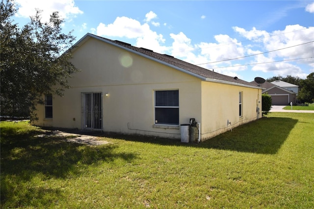 view of side of property featuring a yard