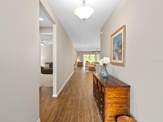 hallway with dark wood-type flooring