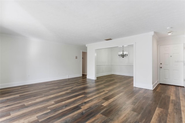 unfurnished living room with ornamental molding, a chandelier, and dark hardwood / wood-style flooring