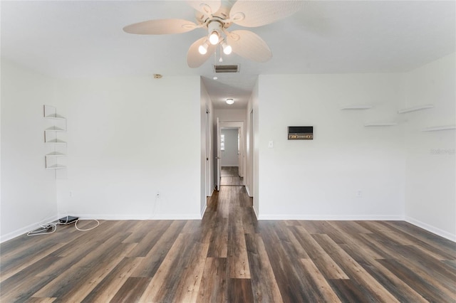 unfurnished room with dark wood-type flooring and ceiling fan