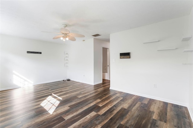 unfurnished room featuring dark wood-type flooring and ceiling fan