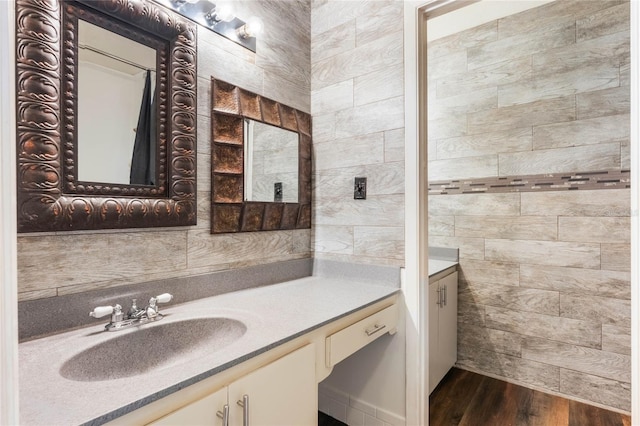 bathroom with vanity and hardwood / wood-style floors