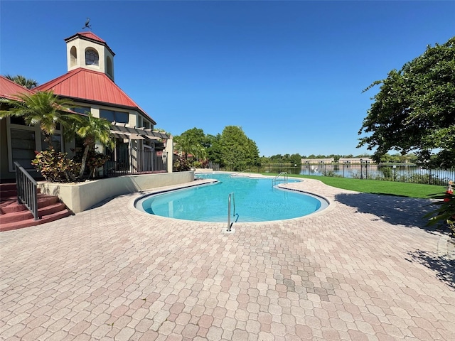 view of swimming pool with a patio area