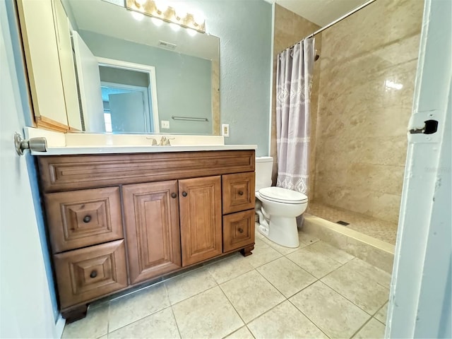 bathroom featuring vanity, toilet, tile patterned floors, and a shower with shower curtain