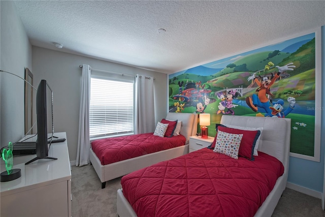 carpeted bedroom featuring a textured ceiling