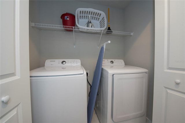 laundry room with washing machine and dryer