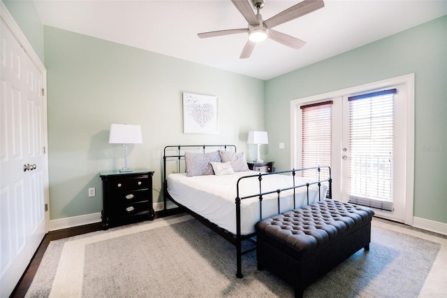 bedroom with ceiling fan, light wood-type flooring, access to outside, and multiple windows