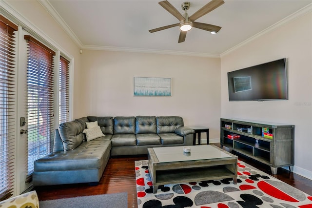 living room with dark wood-type flooring, ceiling fan, ornamental molding, and a wealth of natural light