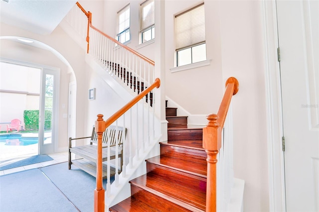 staircase featuring tile patterned floors