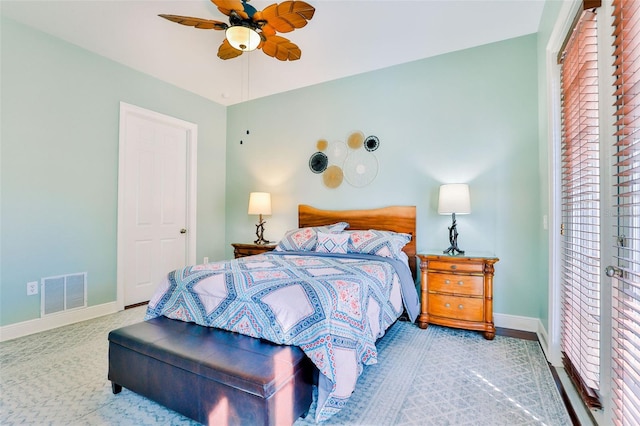 bedroom featuring multiple windows and ceiling fan