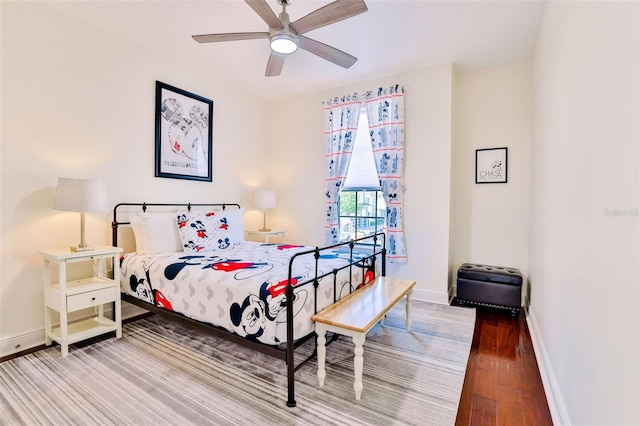 bedroom featuring hardwood / wood-style floors and ceiling fan