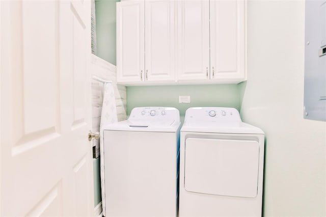 washroom with cabinets and independent washer and dryer