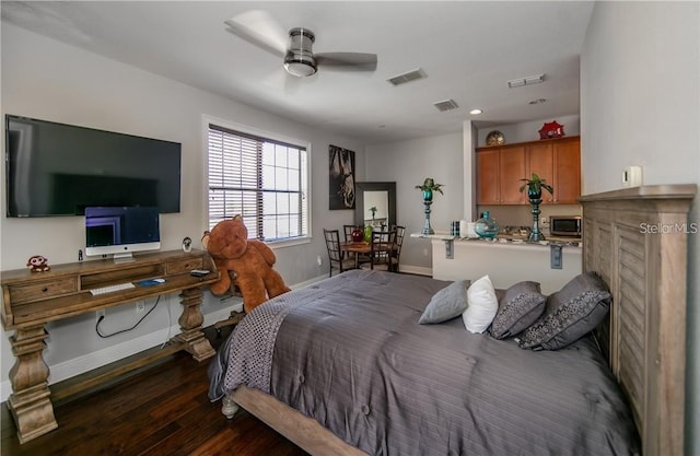 bedroom featuring ceiling fan and dark wood-type flooring