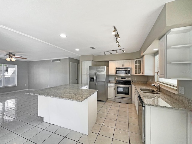759 Little Wekiva Cir, Altamonte Springs, FL 32714 - kitchen featuring open shelves, a sink, light tile patterned floors, appliances with stainless steel finishes, and a kitchen island