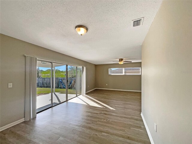 759 Little Wekiva Cir, Altamonte Springs, FL 32714 - spare room with a textured ceiling, baseboards, visible vents, wood finished floors, and ceiling fan