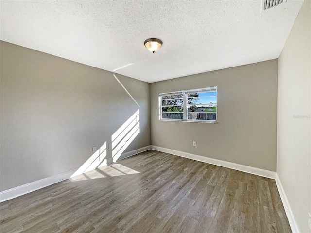 759 Little Wekiva Cir, Altamonte Springs, FL 32714 - unfurnished room with a textured ceiling, wood finished floors, visible vents, and baseboards