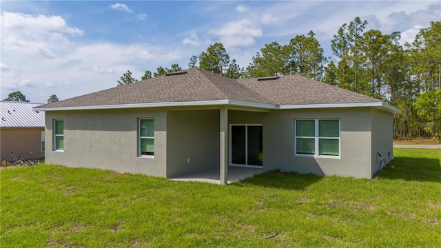 back of house with a yard