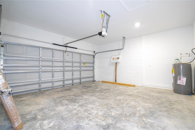 garage with a garage door opener and electric water heater