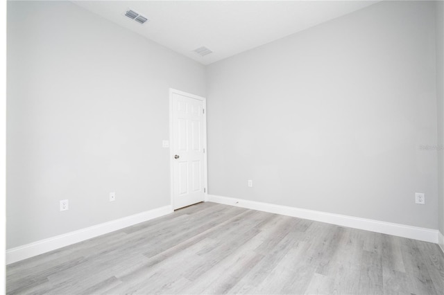 spare room with light wood-type flooring