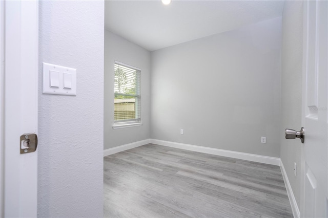 unfurnished room featuring wood-type flooring