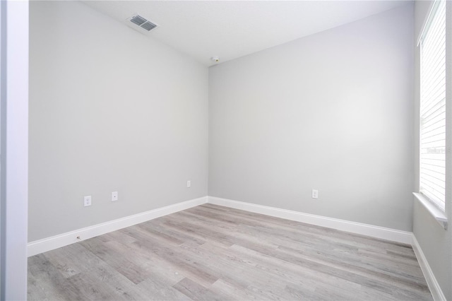 unfurnished room featuring light hardwood / wood-style floors