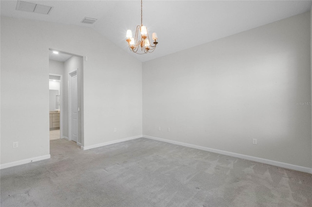 unfurnished room featuring vaulted ceiling, a notable chandelier, and light colored carpet