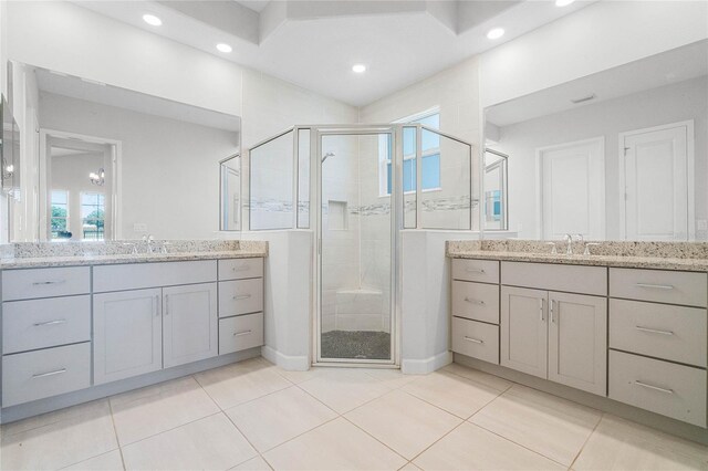 bathroom with oversized vanity, an enclosed shower, and tile floors