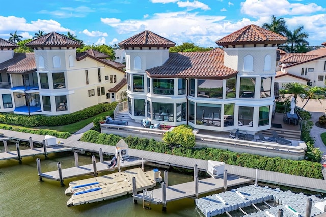 back of house featuring a water view