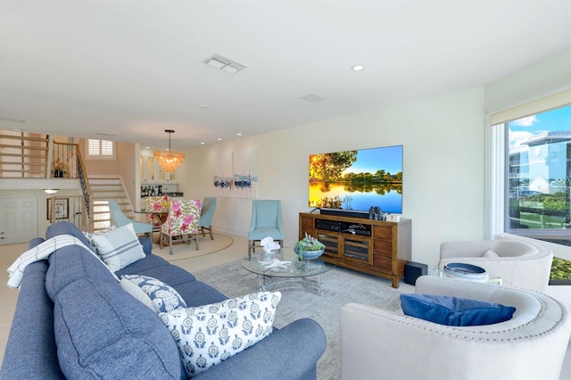 living room with a notable chandelier