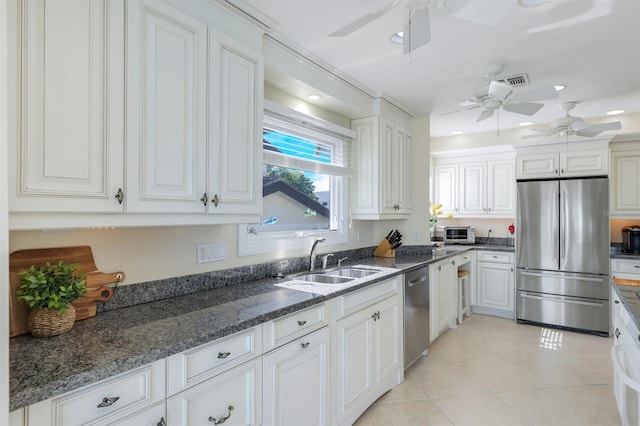 kitchen featuring ceiling fan, light tile floors, sink, white cabinetry, and stainless steel appliances