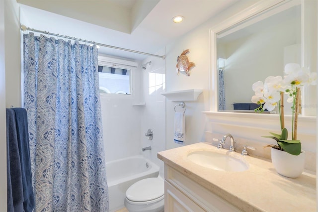 full bathroom featuring vanity, shower / bath combo, and toilet