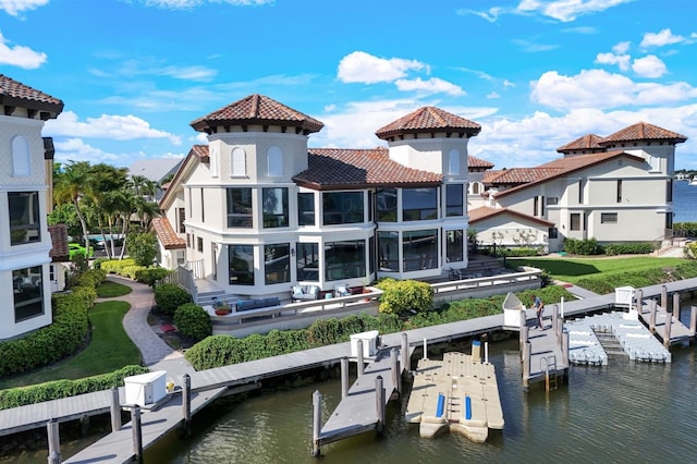 rear view of house with a water view