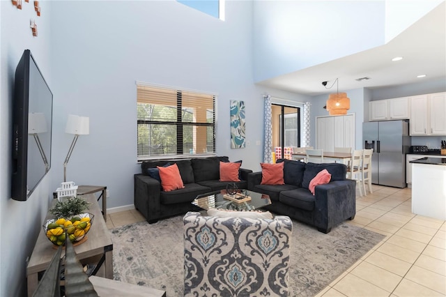 tiled living room featuring a healthy amount of sunlight