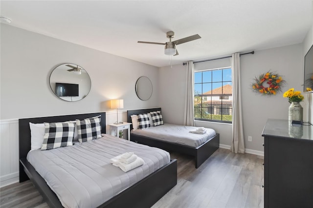 bedroom featuring wood-type flooring and ceiling fan