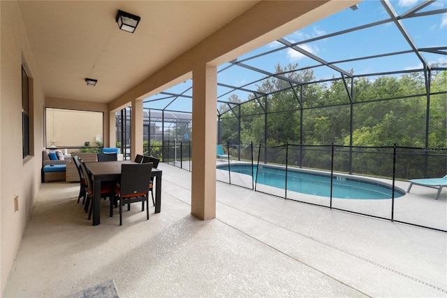 view of swimming pool with a lanai and a patio area