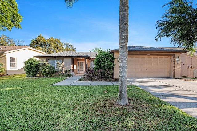 ranch-style house with a garage and a front lawn