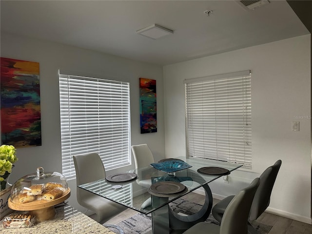 dining area featuring hardwood / wood-style floors