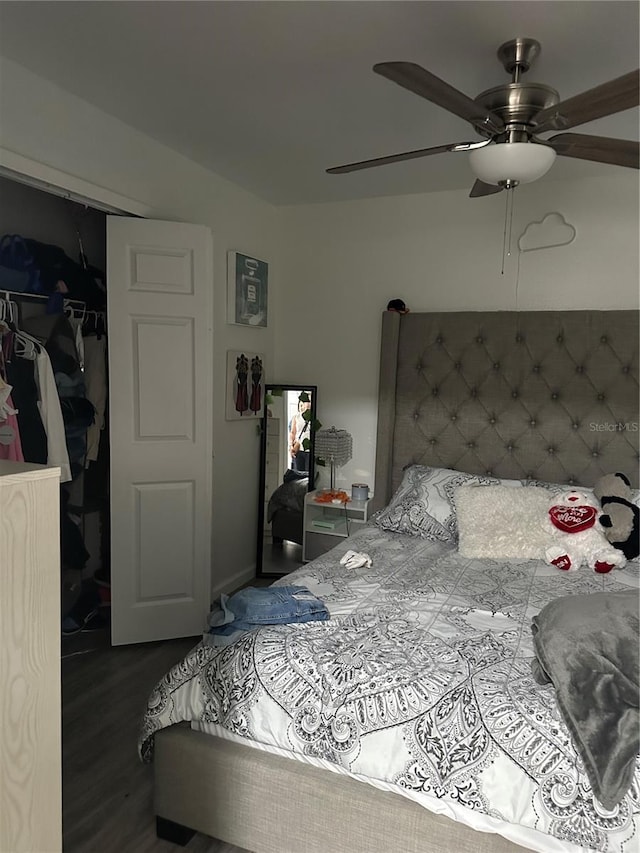 bedroom with a closet, ceiling fan, and dark hardwood / wood-style flooring