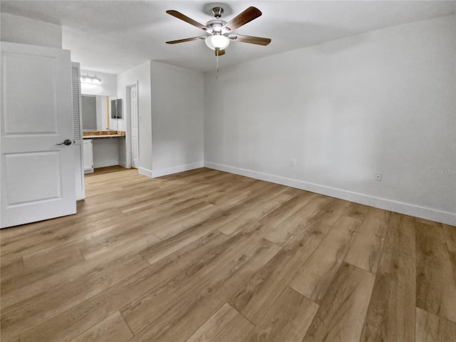 unfurnished room featuring ceiling fan and light hardwood / wood-style floors