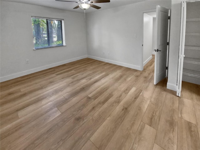 unfurnished room featuring ceiling fan and light hardwood / wood-style flooring