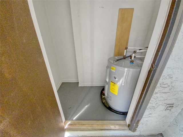 utility room featuring electric water heater