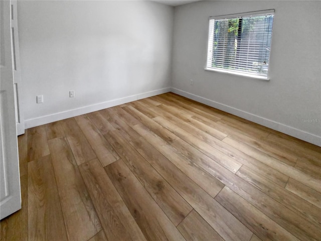 unfurnished room featuring light hardwood / wood-style floors