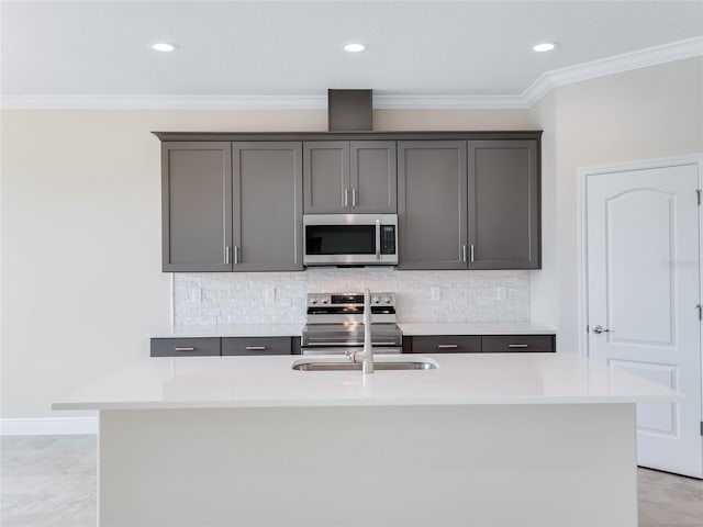 kitchen featuring a kitchen island with sink, gray cabinets, light tile flooring, and stainless steel appliances